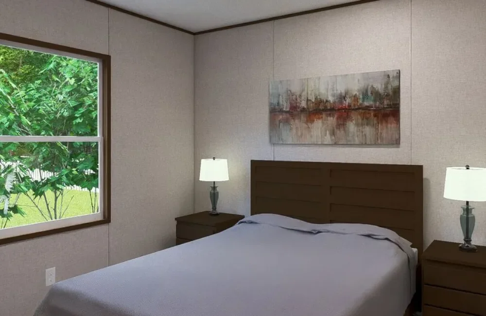 A bedroom with a bed, two nightstands with lamps, a painting above the headboard, and a window showing greenery outside.