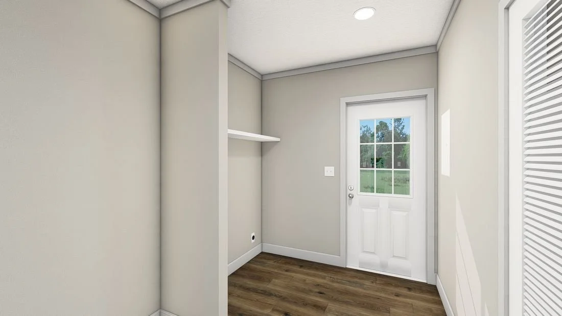 Empty room with a door with a window and a small built-in shelf on the wall.