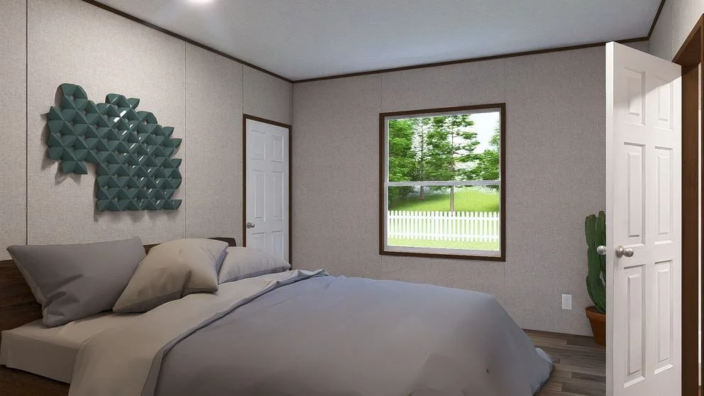 A bedroom with a bed, a window showing trees and a white fence outside, a decorative wall art piece above the bed, and a potted plant near the open door.