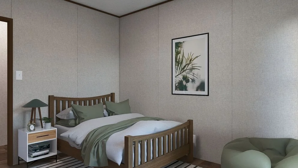 A bedroom with a wooden bed, green and white bedding, a white nightstand with a lamp, clock, and plants, a framed art print of green leaves on the wall, and a green bean bag chair.