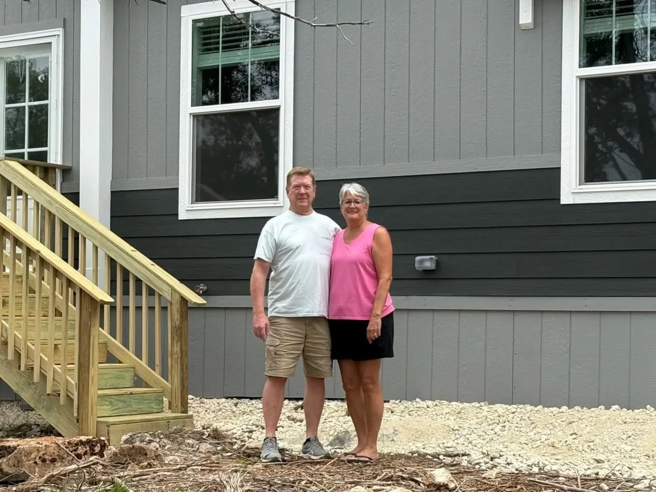 New homeowner with their manufactured home sold by Cowboy Capital Cottages in Bandera TX