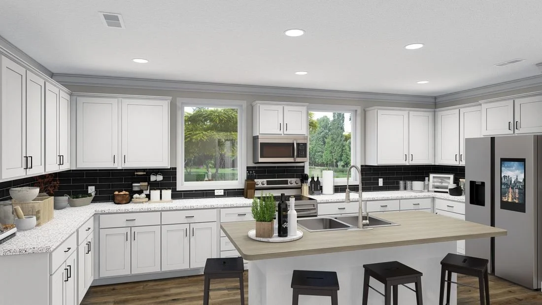 Modern white kitchen with an island, stainless steel appliances, and black backsplash tiles.