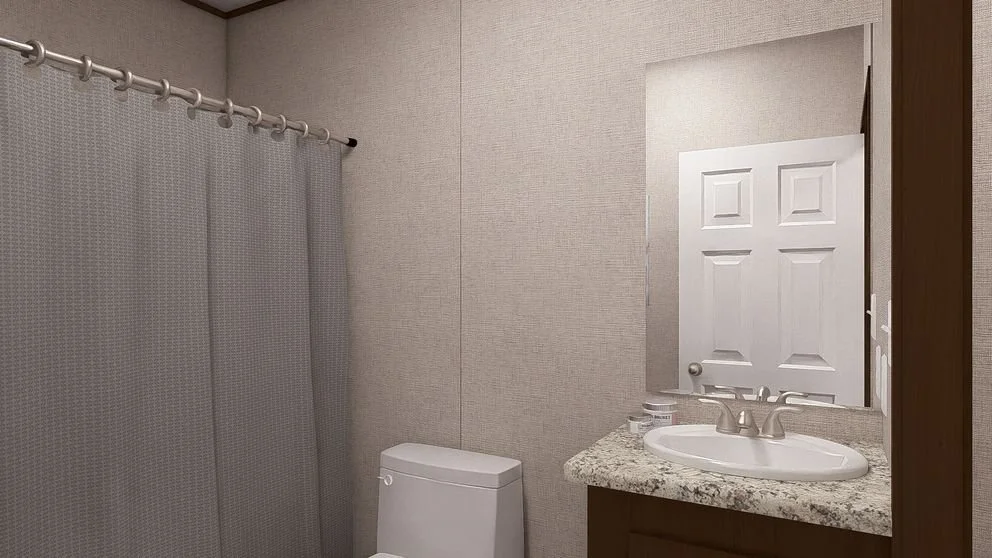 Bathroom with a toilet, granite countertop sink, mirror, and shower curtain