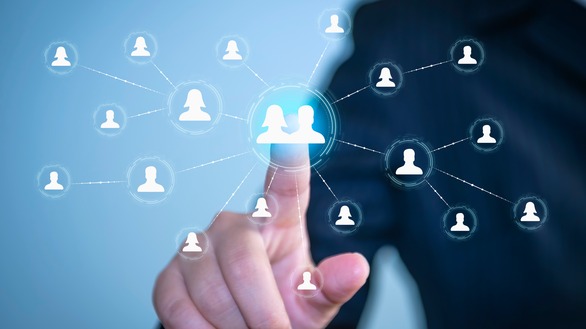 Person touching a digital social network diagram with interconnected user icons.