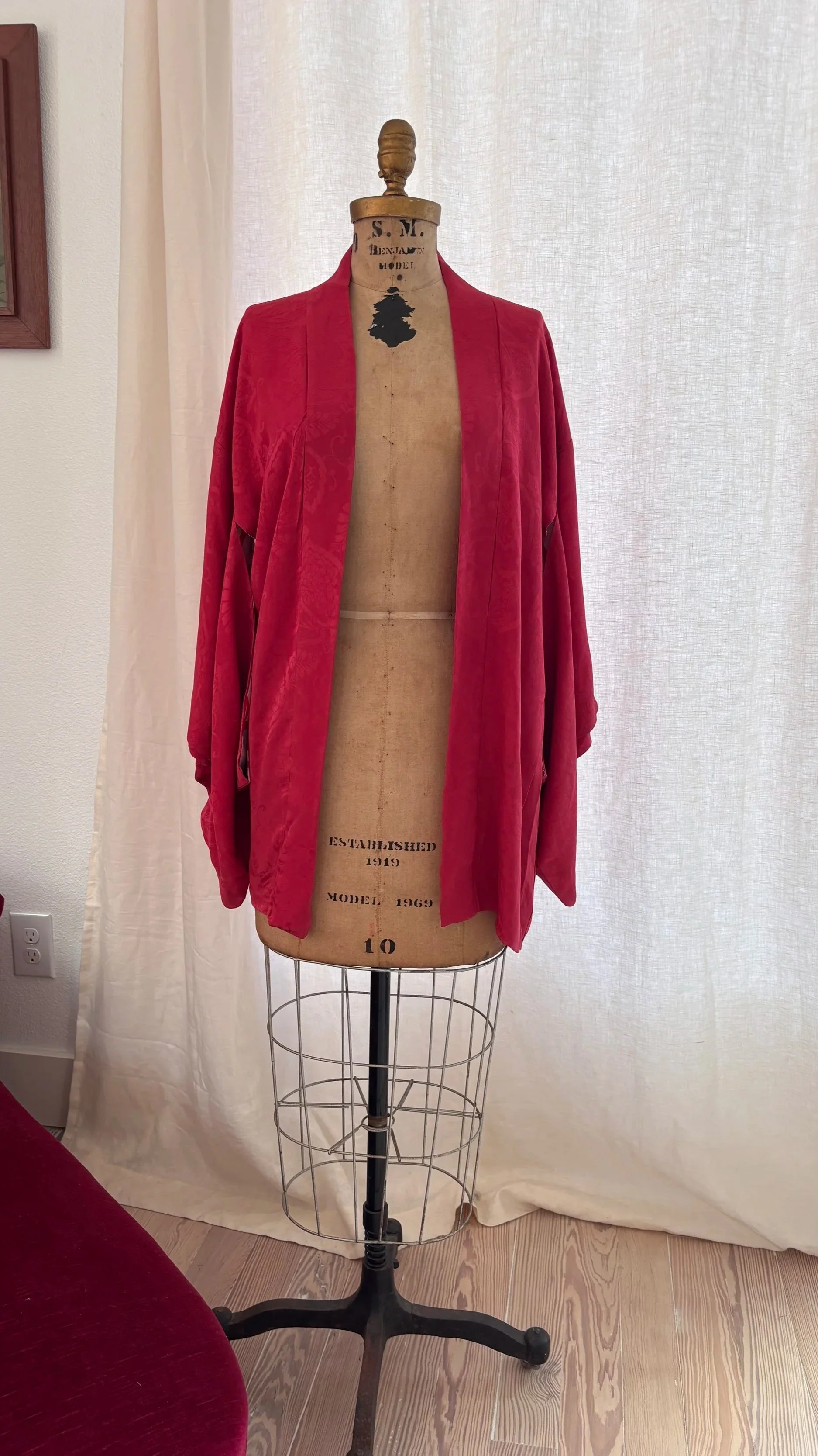 Front view of vintage Japanese crimson silk haori worn open