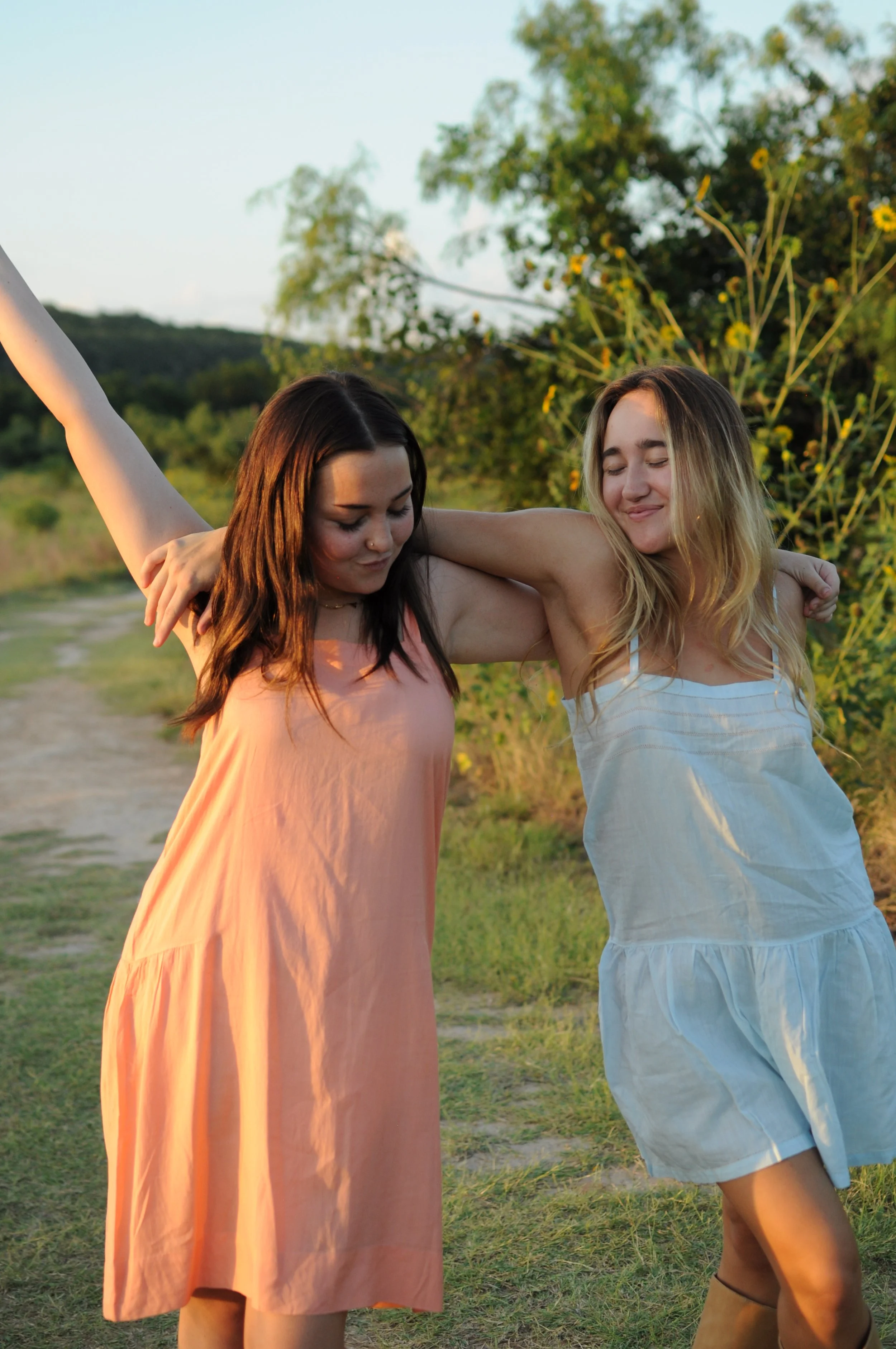 best friends dancing in colorful French vintage dresses