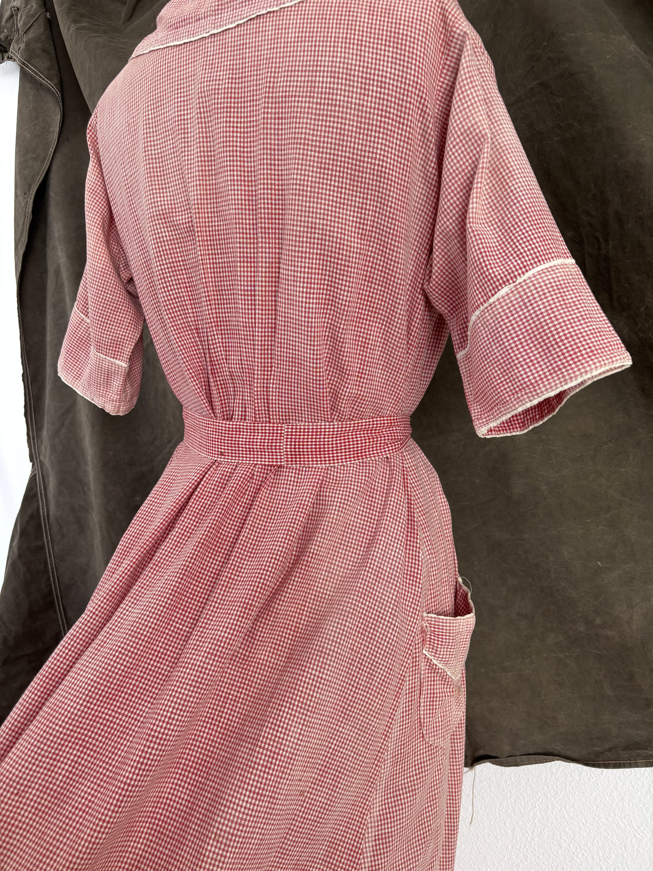 Close-up of gathered back waist and cuff detail on vintage gingham house dress