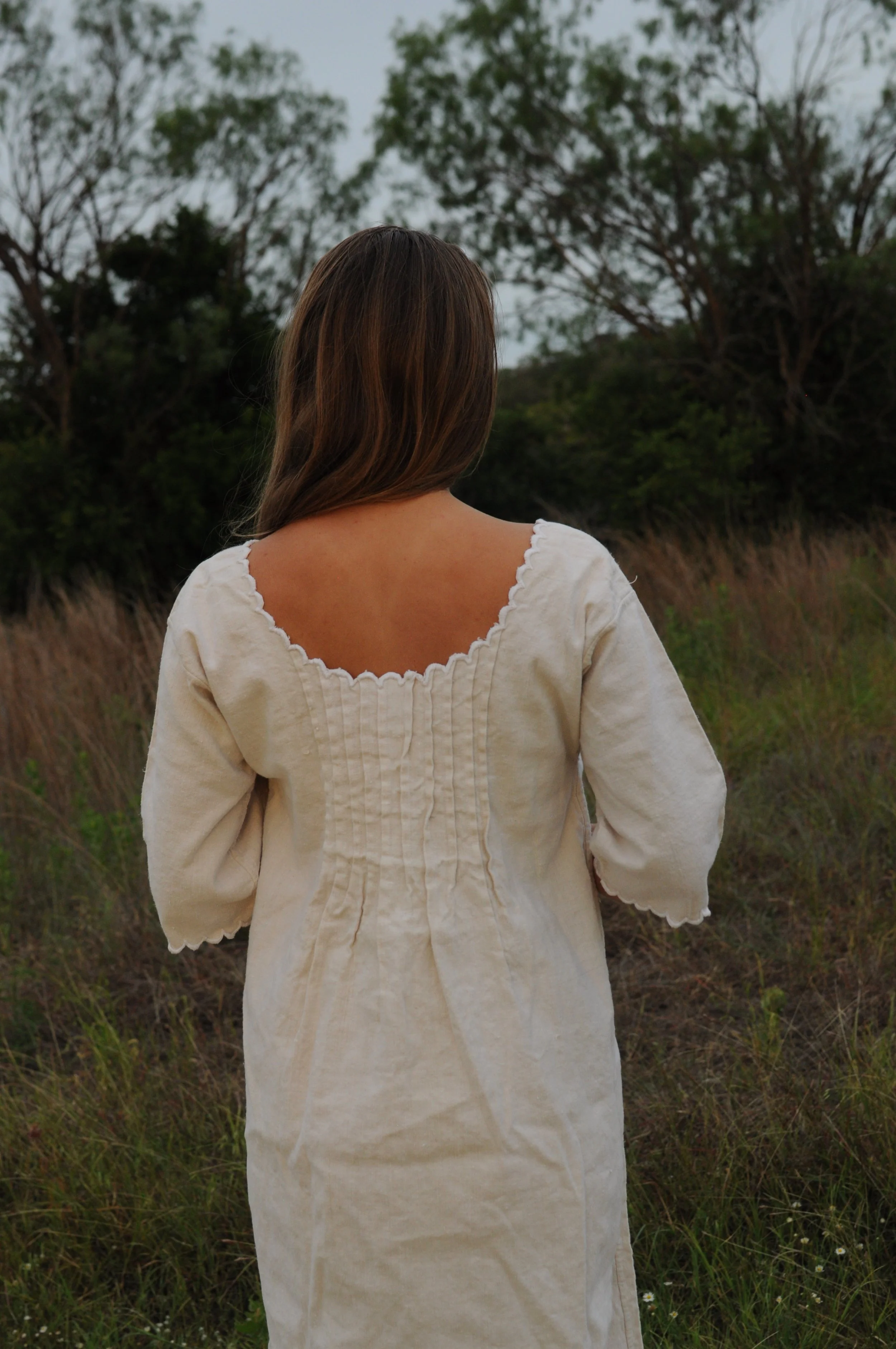 Back view of antique Edwardian French homespun linen day dress with gathered pintucks
