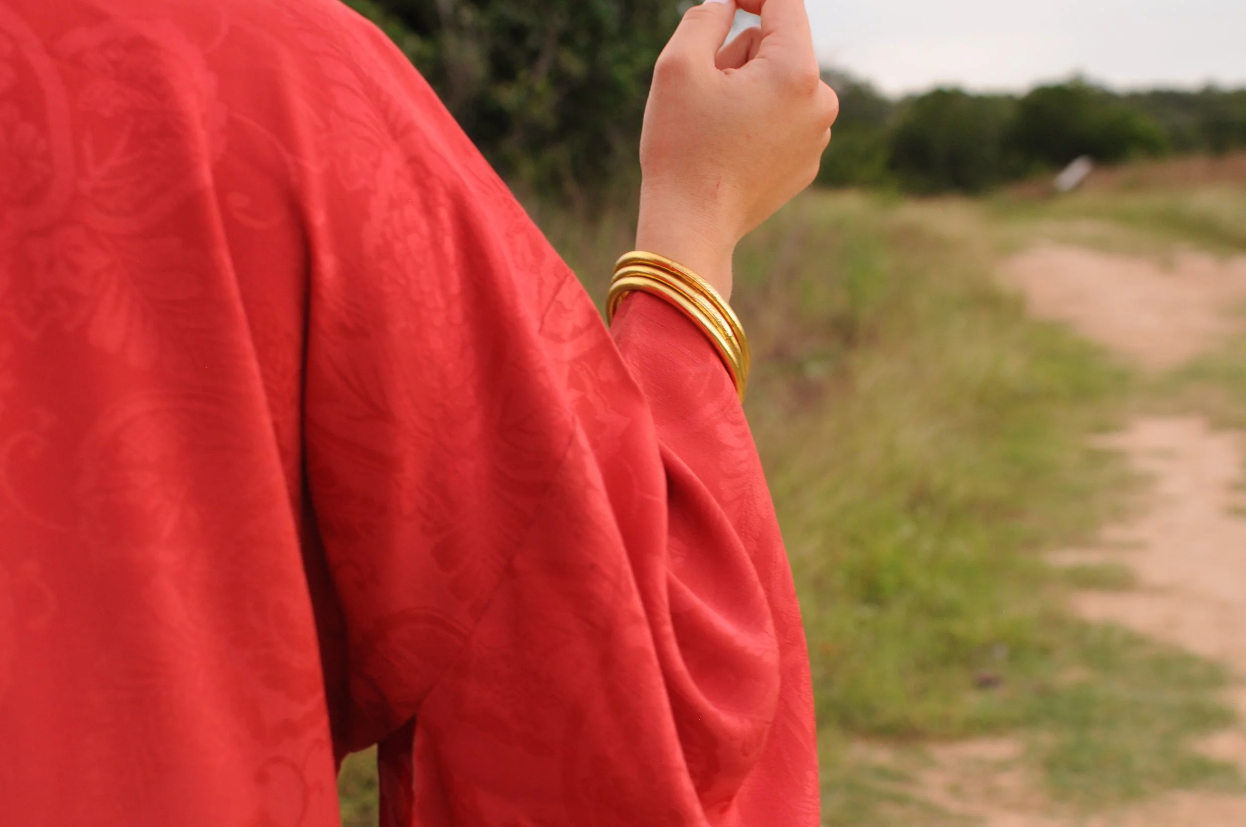 Close-up of sleeve and cuff on vintage crimson silk Japanese haori