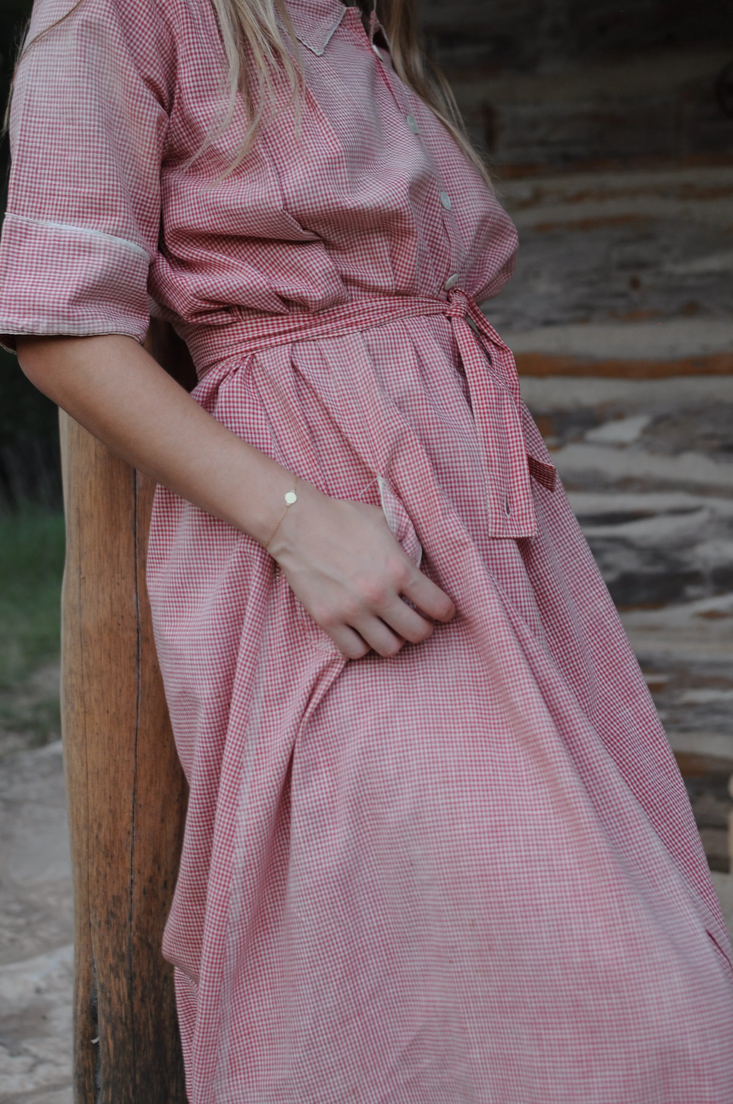 Close-up of waist tie and gathered skirt on 1940s strawberry gingham house dress