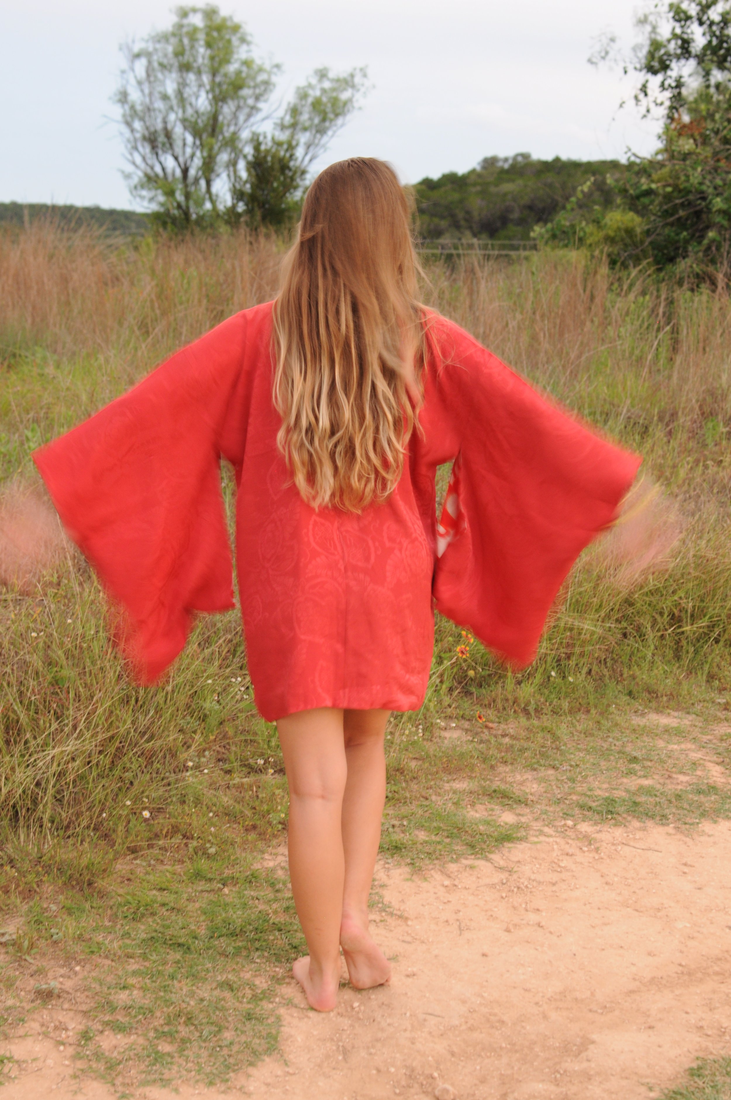 Back view of vintage crimson silk haori with traditional kimono silhouette