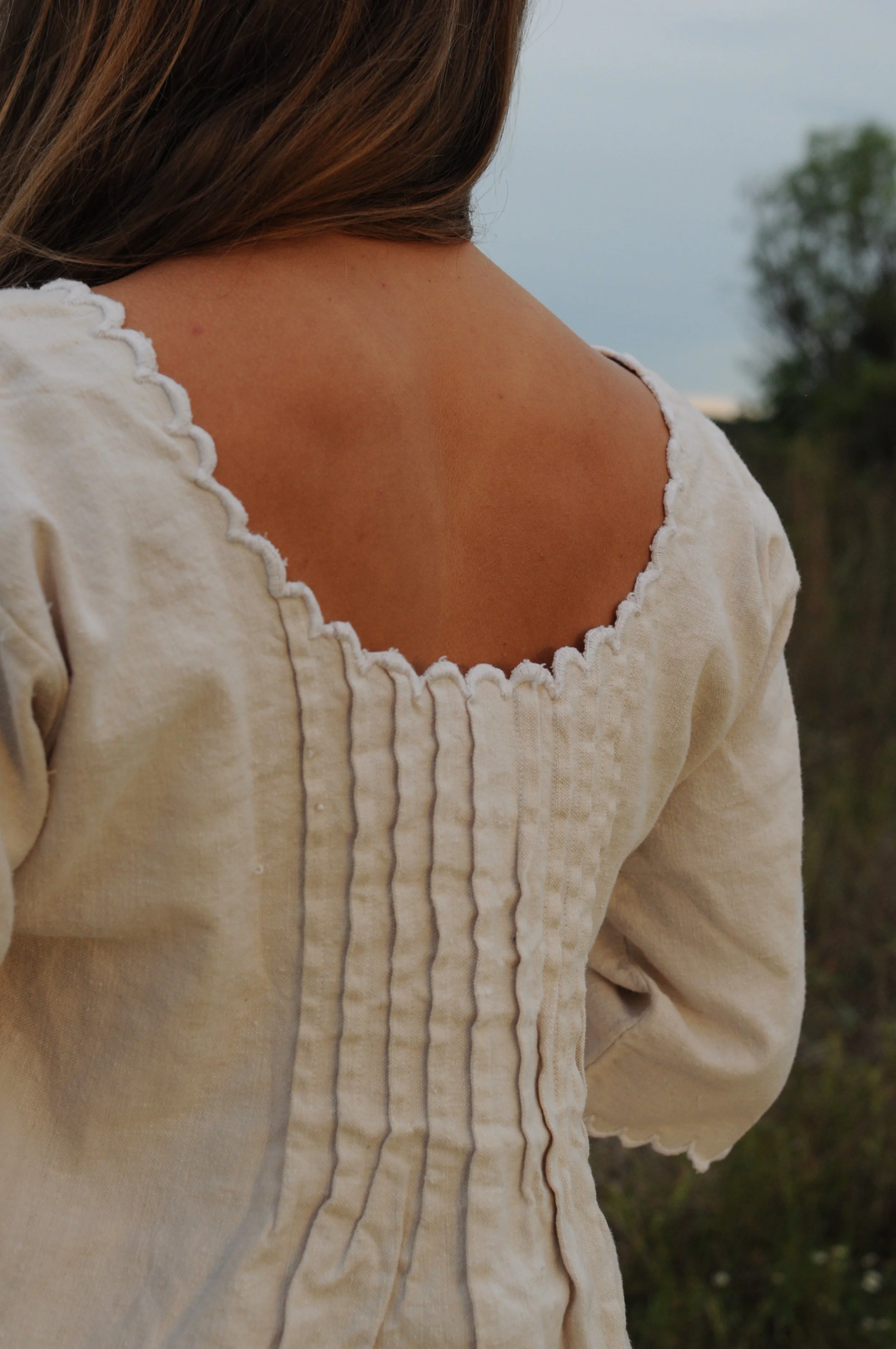 Close-up of scalloped back neckline on antique French linen dress
