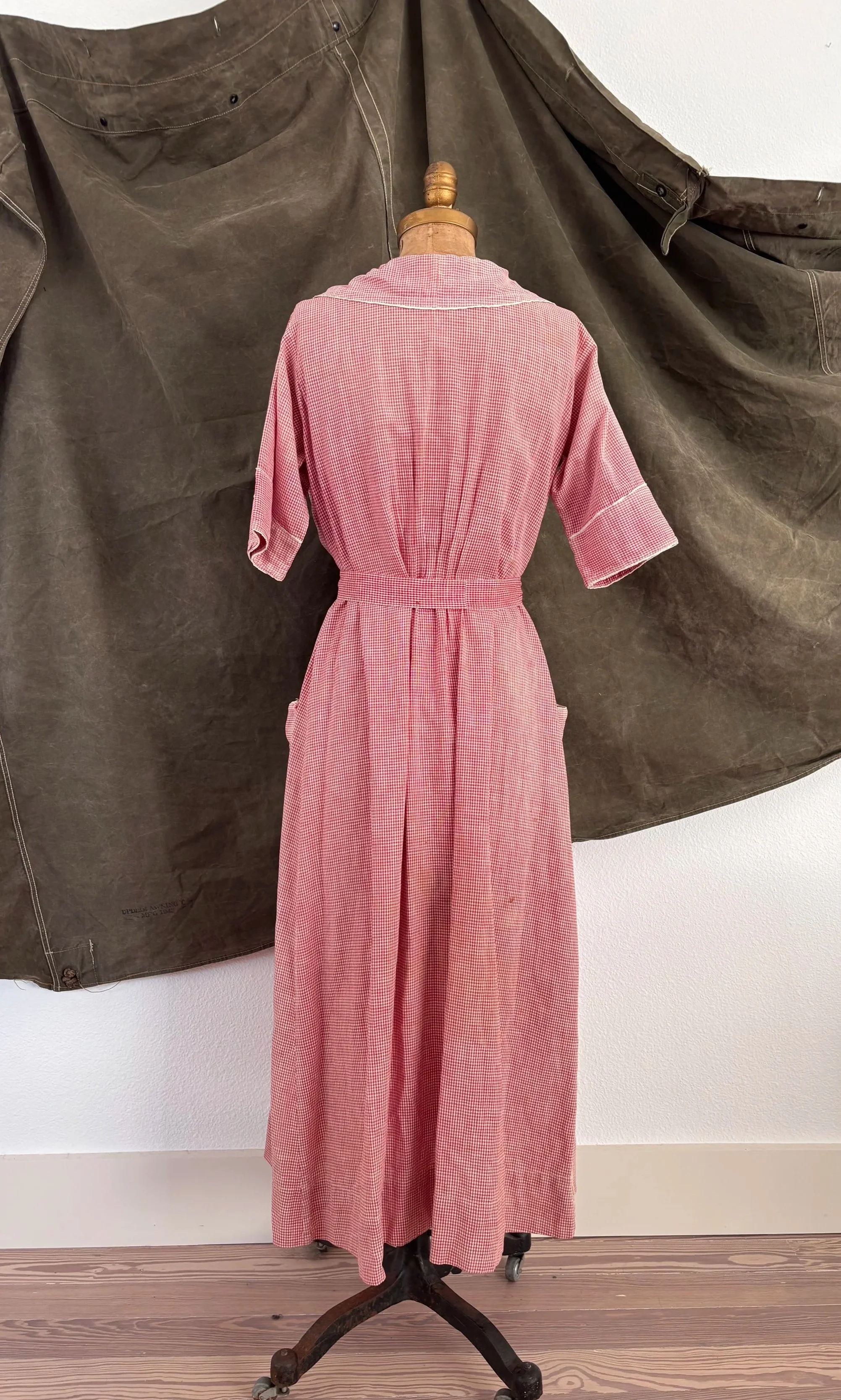Back view of vintage 1940s strawberry gingham house dress on dress form