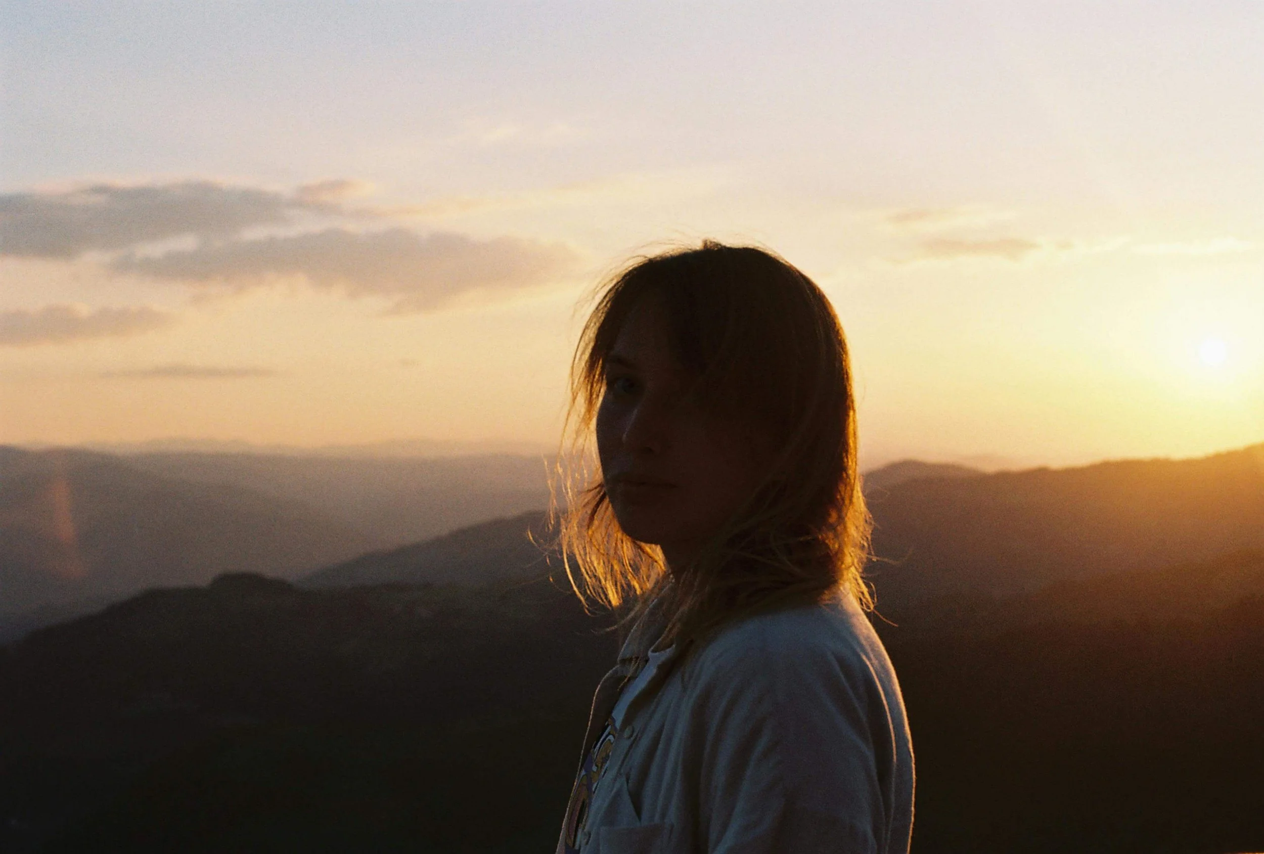 Person standing quietly at sunset, reflecting on grief and anxiety in Sacramento, CA after experiencing a meaningful loss.