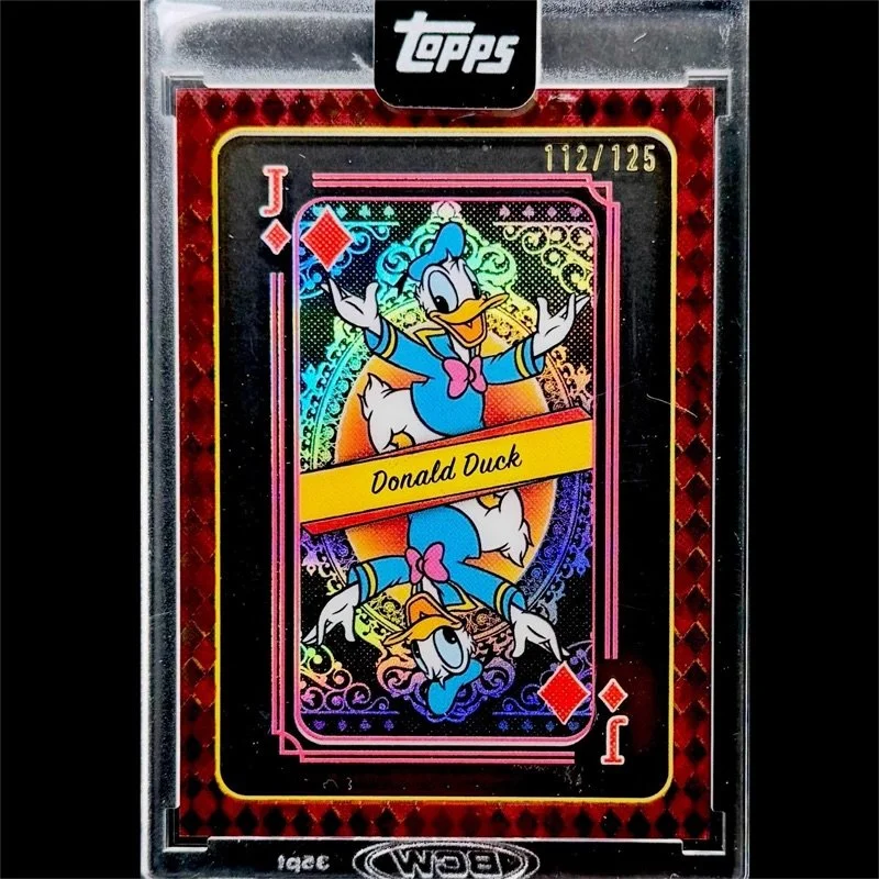 Holographic collectible Topps trading card featuring Donald Duck as the Jack of Diamonds, with colorful, iridescent background and the name 'Donald Duck' on a yellow banner in the center.