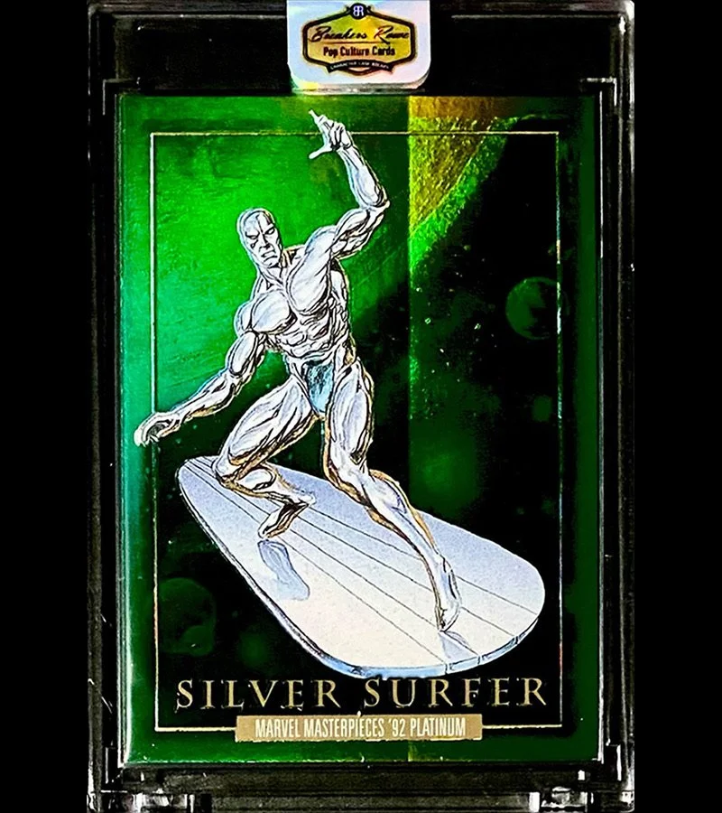 A collectible card titled "Silver Surfer" from Marvel Masterpieces 92 Platinum featuring a metallic illustration of the Silver Surfer surfing on a shiny surfboard against a cosmic green background.