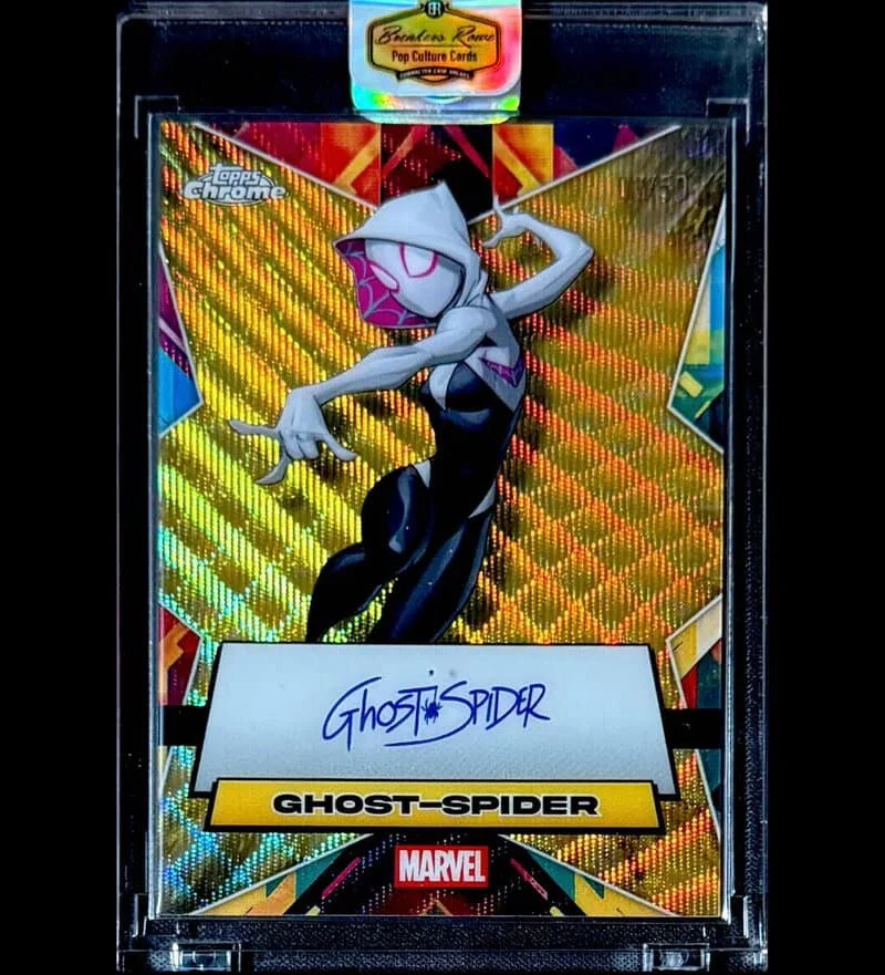 Marvel trading card featuring Ghost-Spider, a female character with a white hood and gloves, in a dynamic pose with a holographic background.