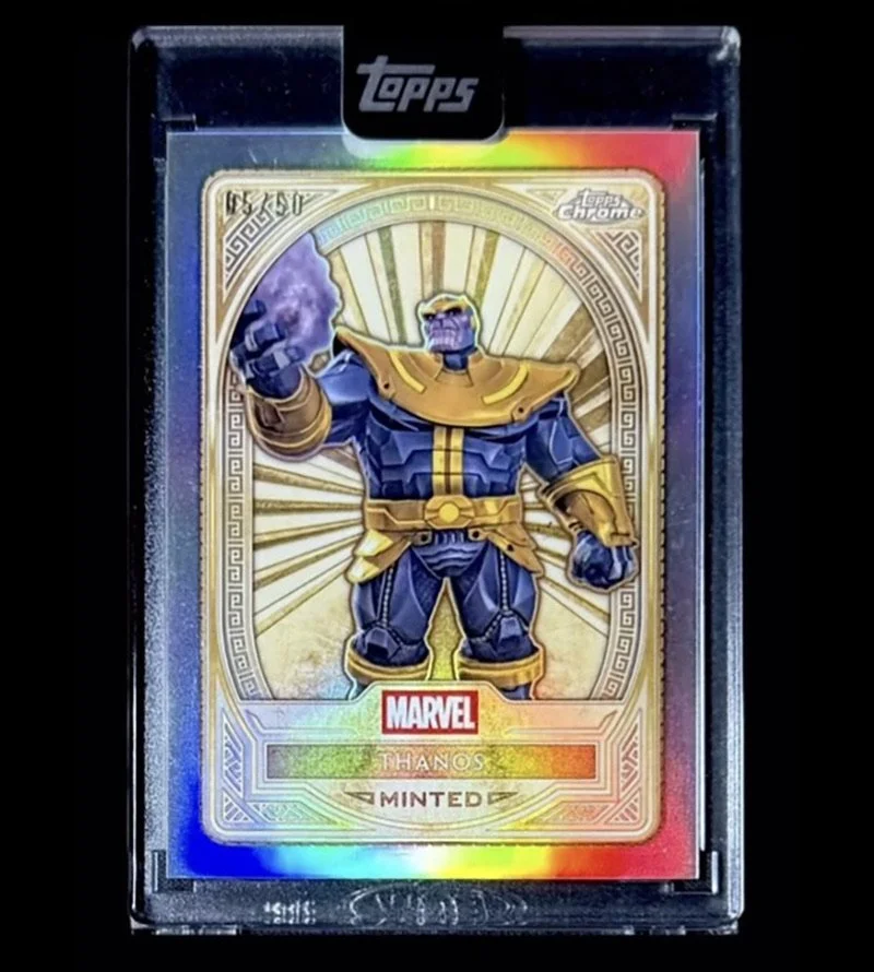 Marvel Thanos collectible card from Topps Chrome, featuring an illustration of Thanos in armor with a glowing background, encased in a protective plastic case.