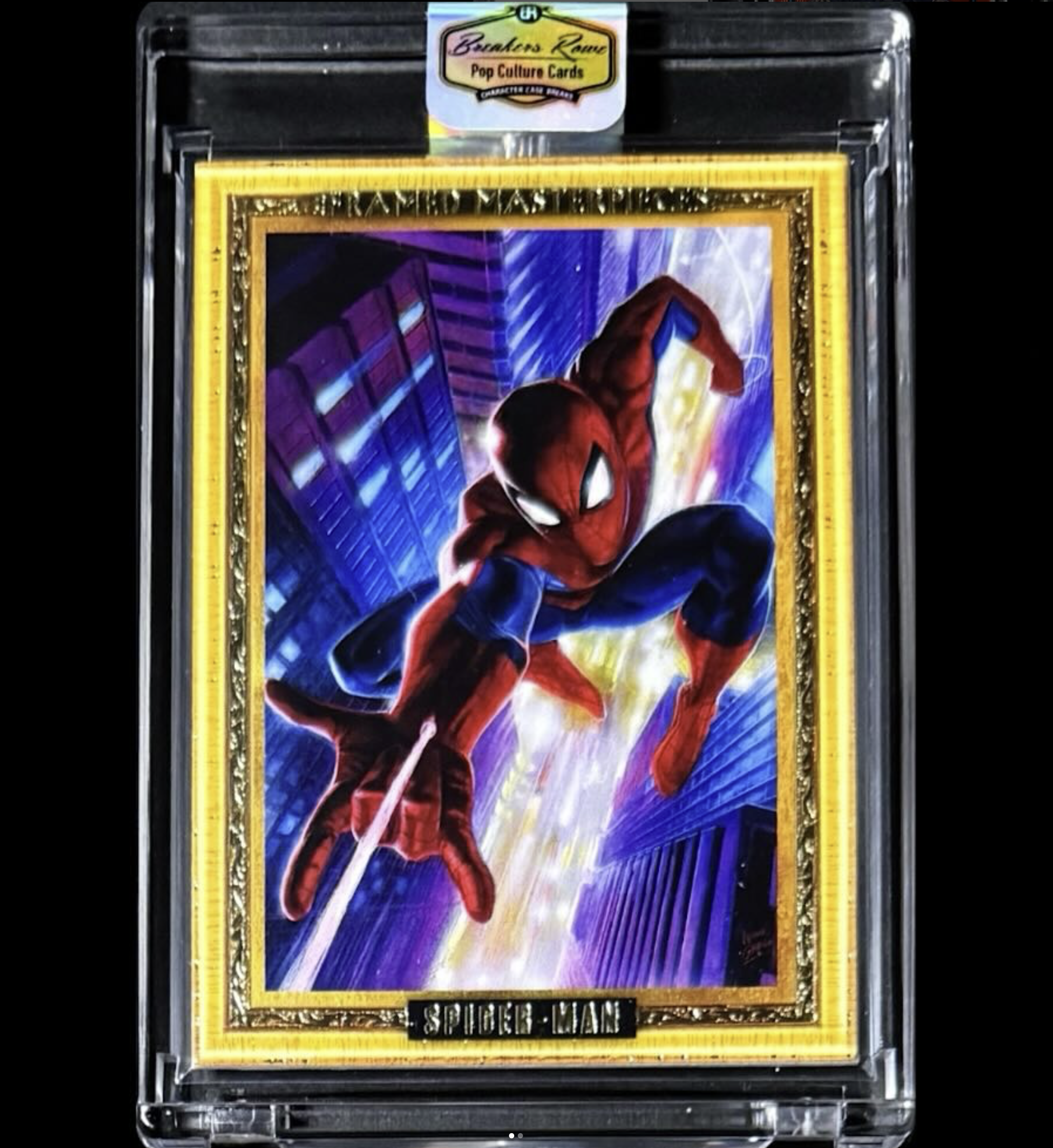 A Spider-Man trading card featuring Spider-Man swinging through a cityscape at night with tall buildings and bright lights.