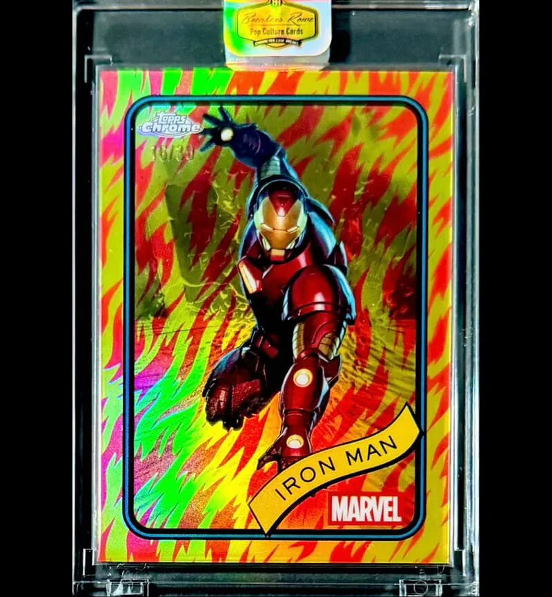 Holographic trading card featuring Iron Man from Marvel, with a background of red, yellow, green, and pink flames.