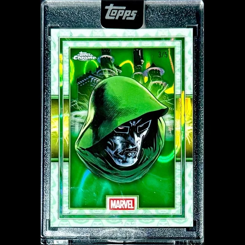 A Marvel-themed Topps Chrome trading card featuring a character in a dark hood with a metallic face, set against a green background with a city skyline and lightning effects.