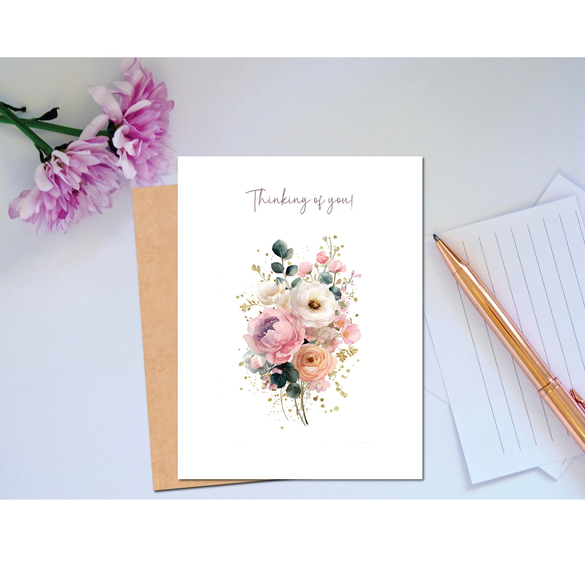 Greeting card with watercolor floral design and the words “Thinking of You” on the front.