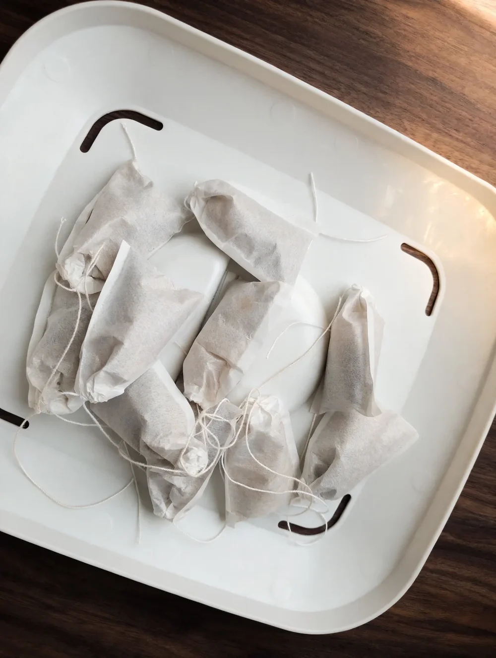 TriNeuroBrew 10 Pack — ten hand-filled white sachets on the tray