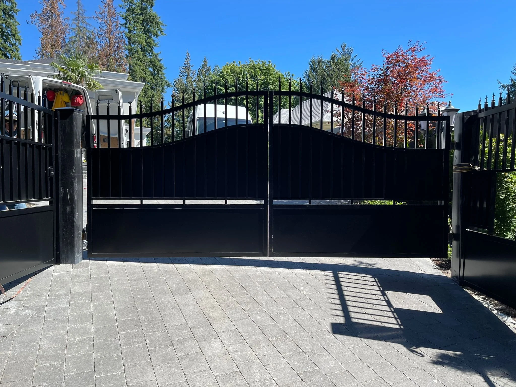 Custom aluminum  steel driveway gate with modern black finish | Iron Age 105