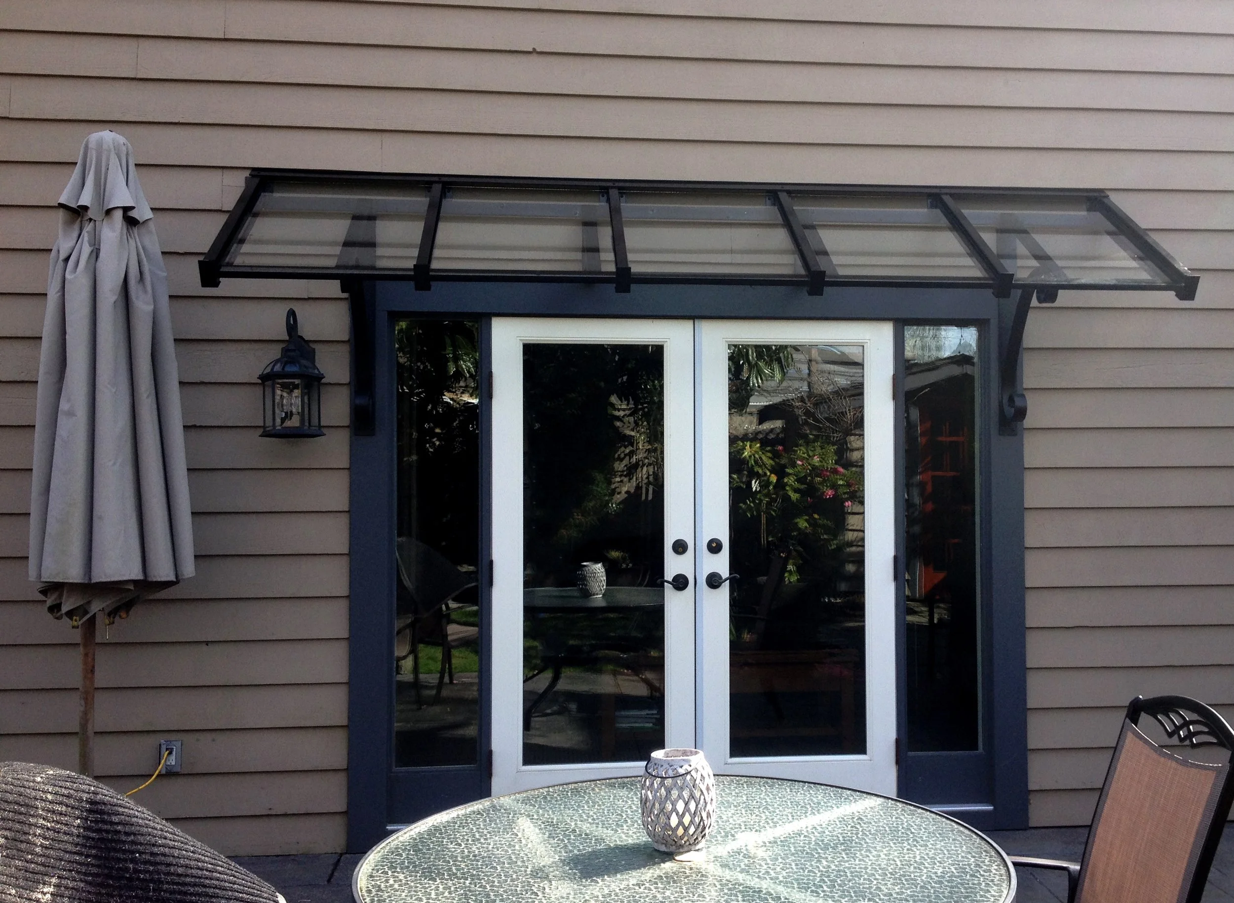 residential project Glass canopy over patio Vancouver modern design 2