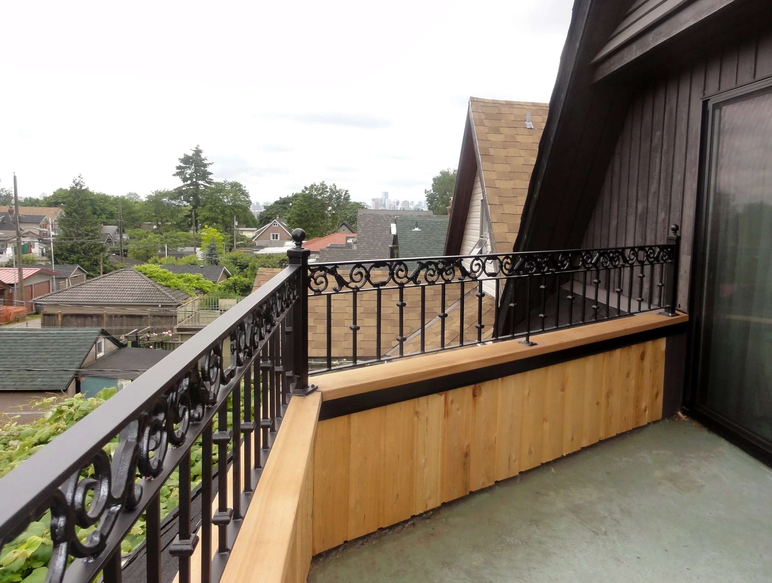 Black metal deck railing residential Vancouver