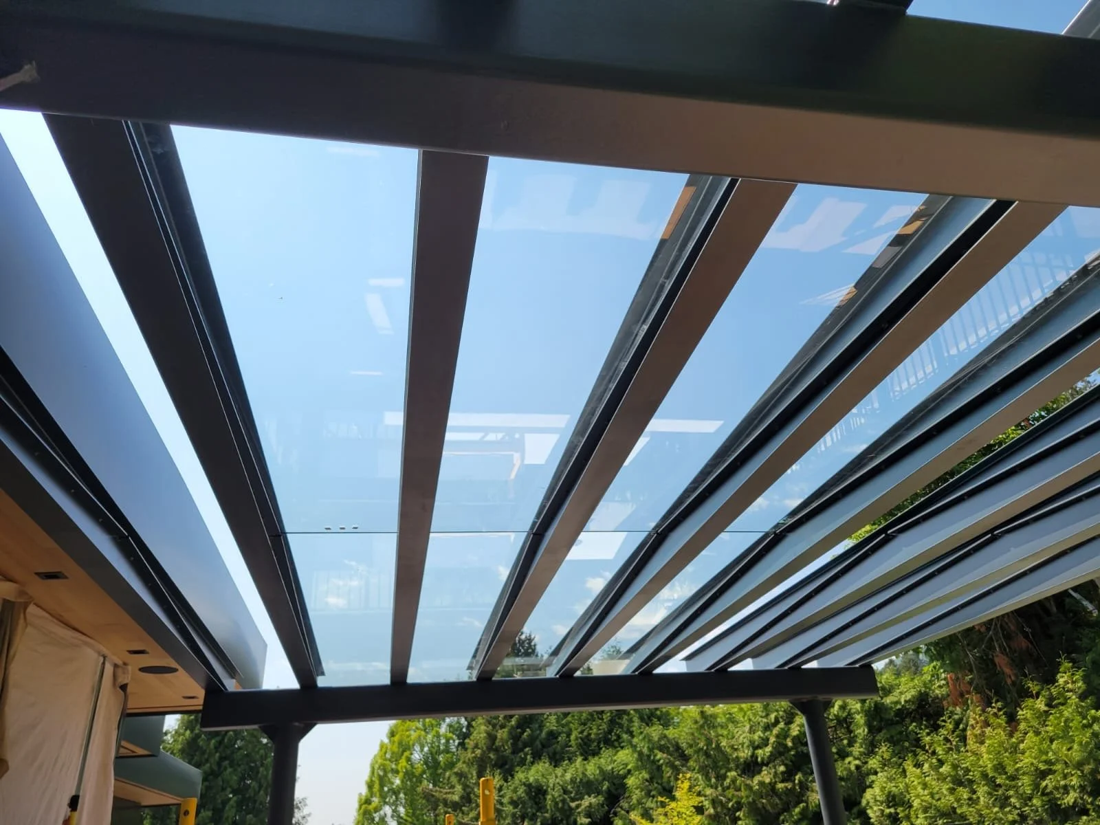 Glass canopy over patio Vancouver modern design