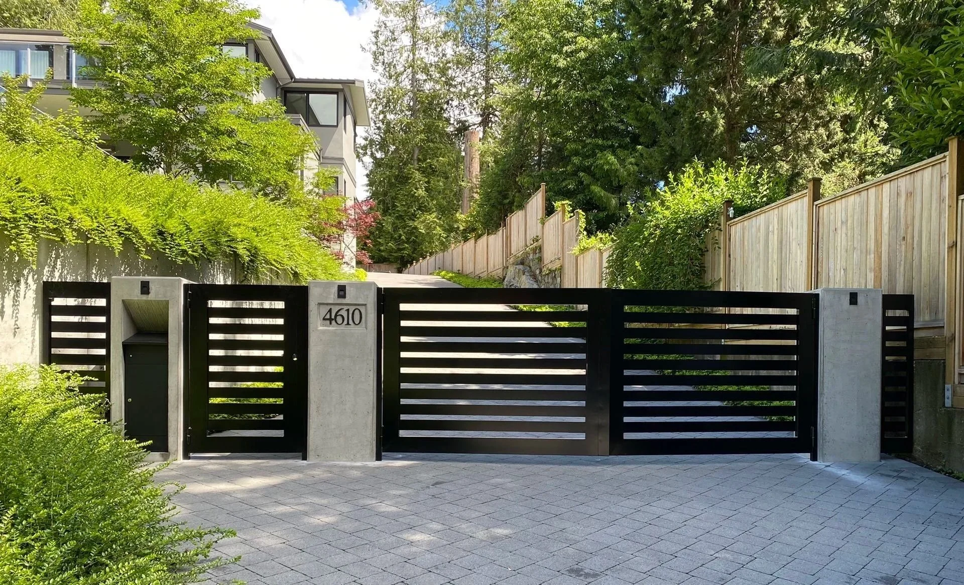 Custom aluminum steel driveway gate with modern black finish | Iron Age 55