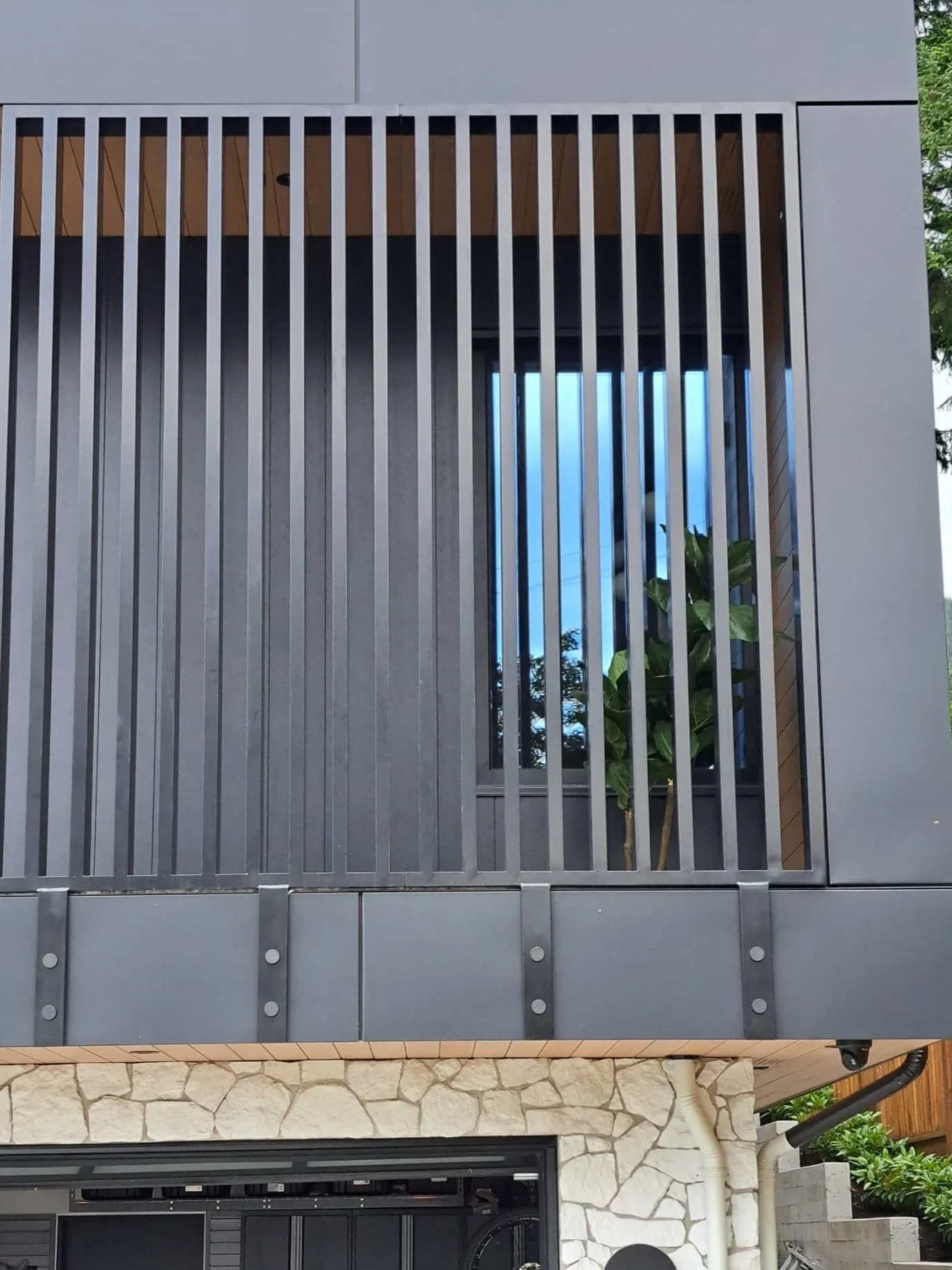 Modern vertical metal privacy screen Vancouver residential