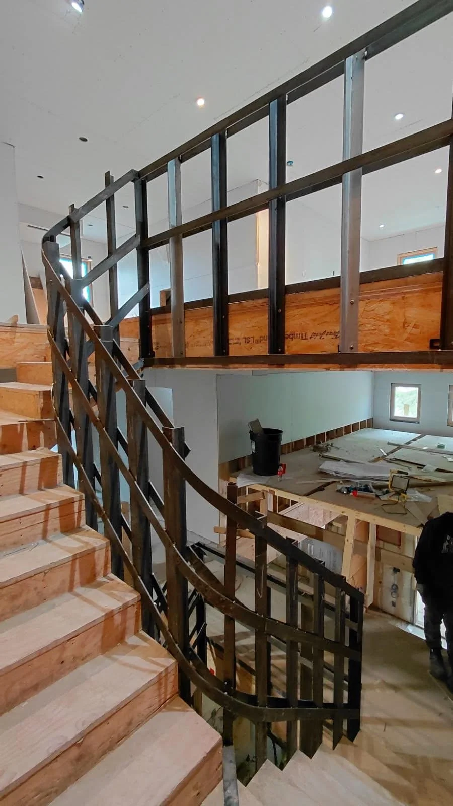 Curved Staircase Railing Framework by Iron Age