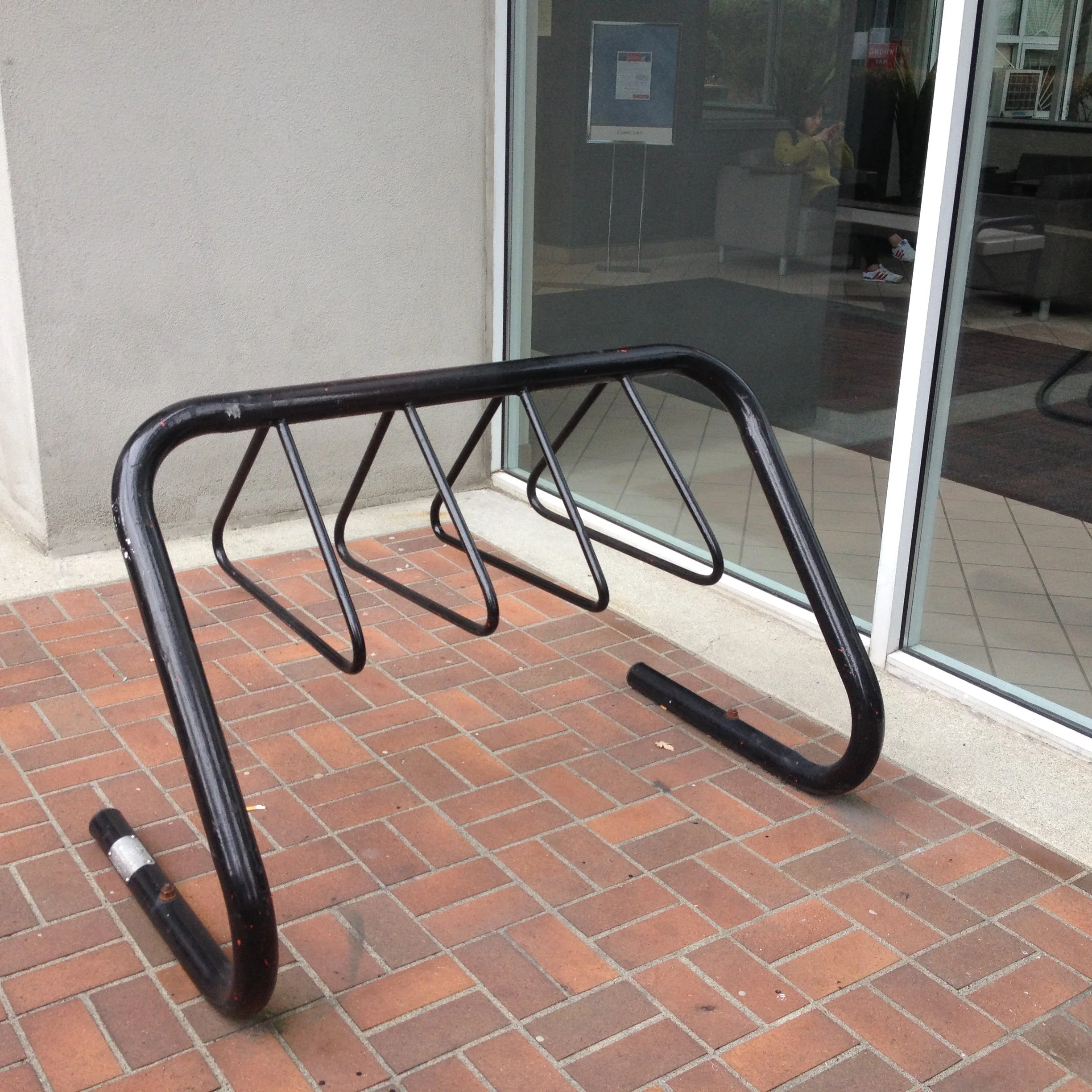 custom metal bike rack Vancouver commercial exterior