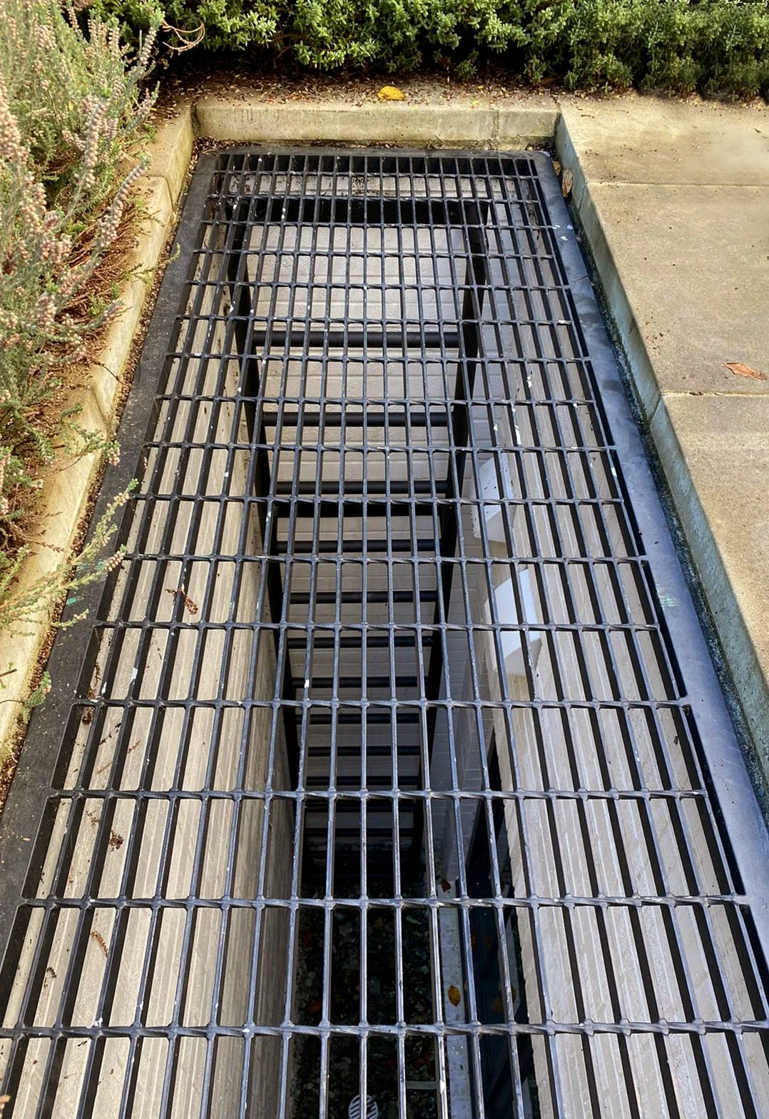 metal window well grate over basement stairs vancouver