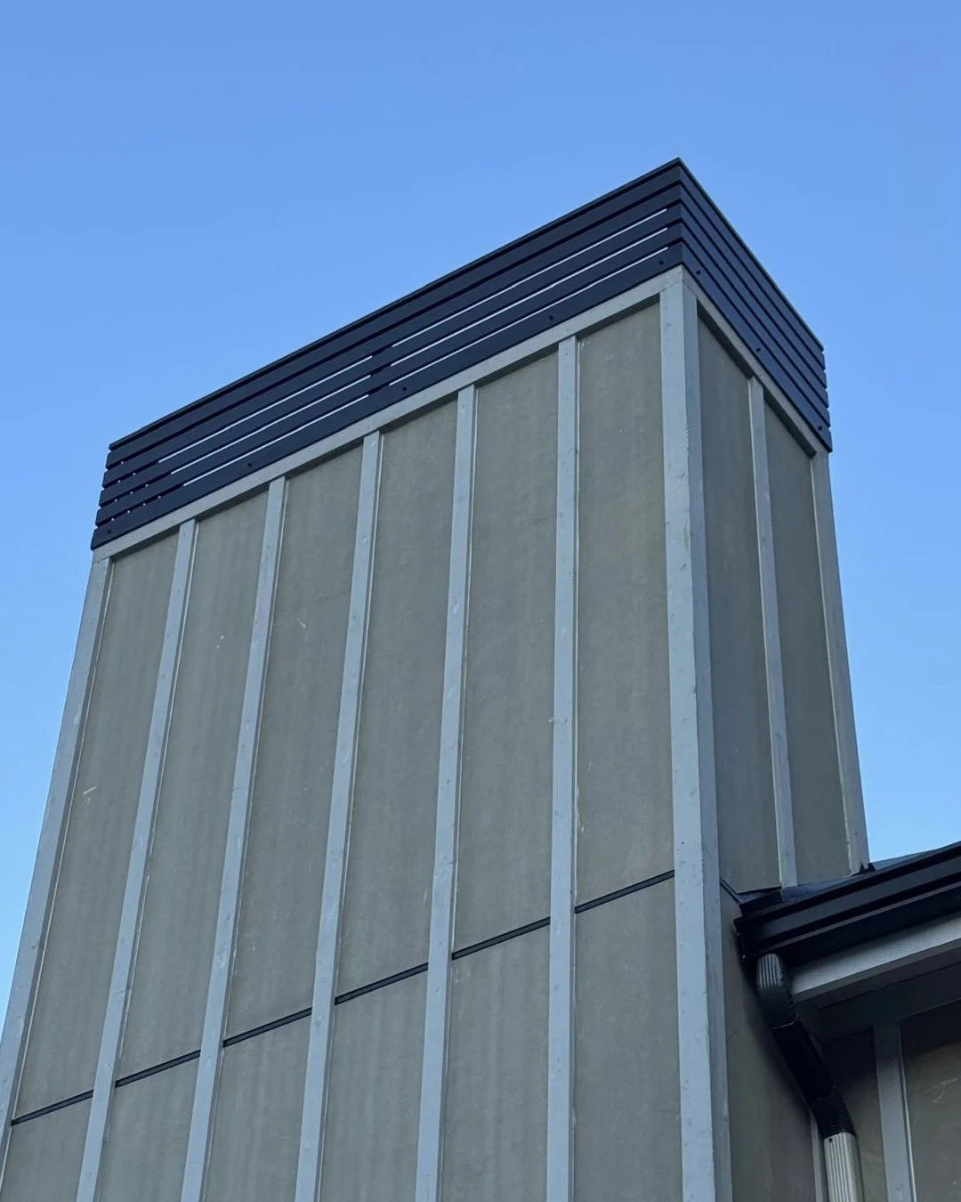 Modern chimney cap metal design Vancouver residential