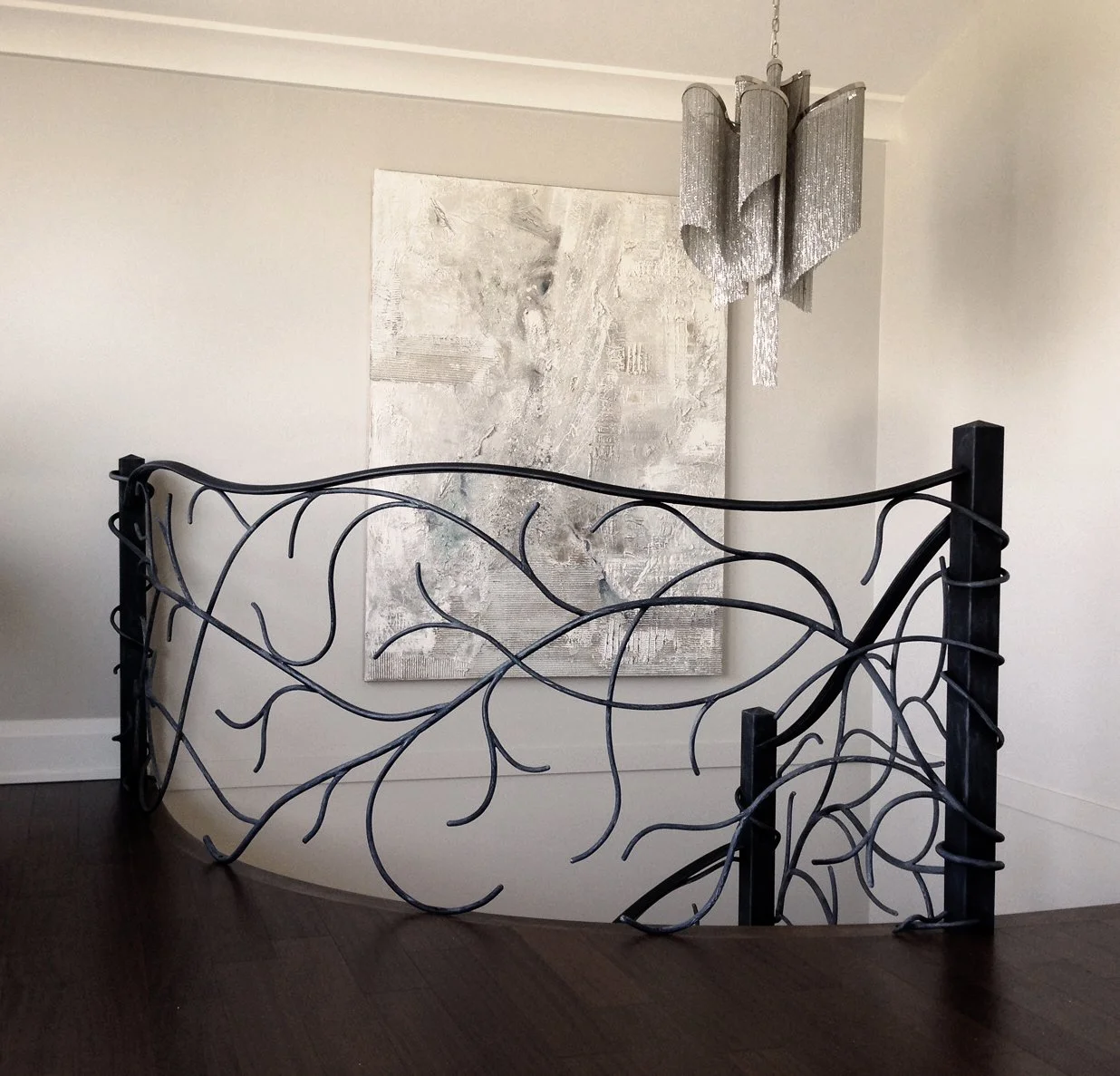 Luxury interior wrought iron guardrail for curved staircase Vancouver