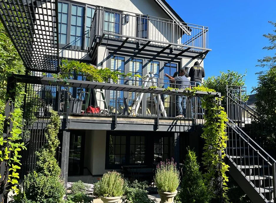 Minimal steel canopy Vancouver exterior walkway residential project