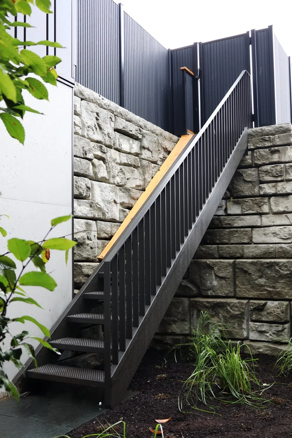 Exterior metal staircase with durable steel structure and safety railings by Iron Age Manufacturing.150

