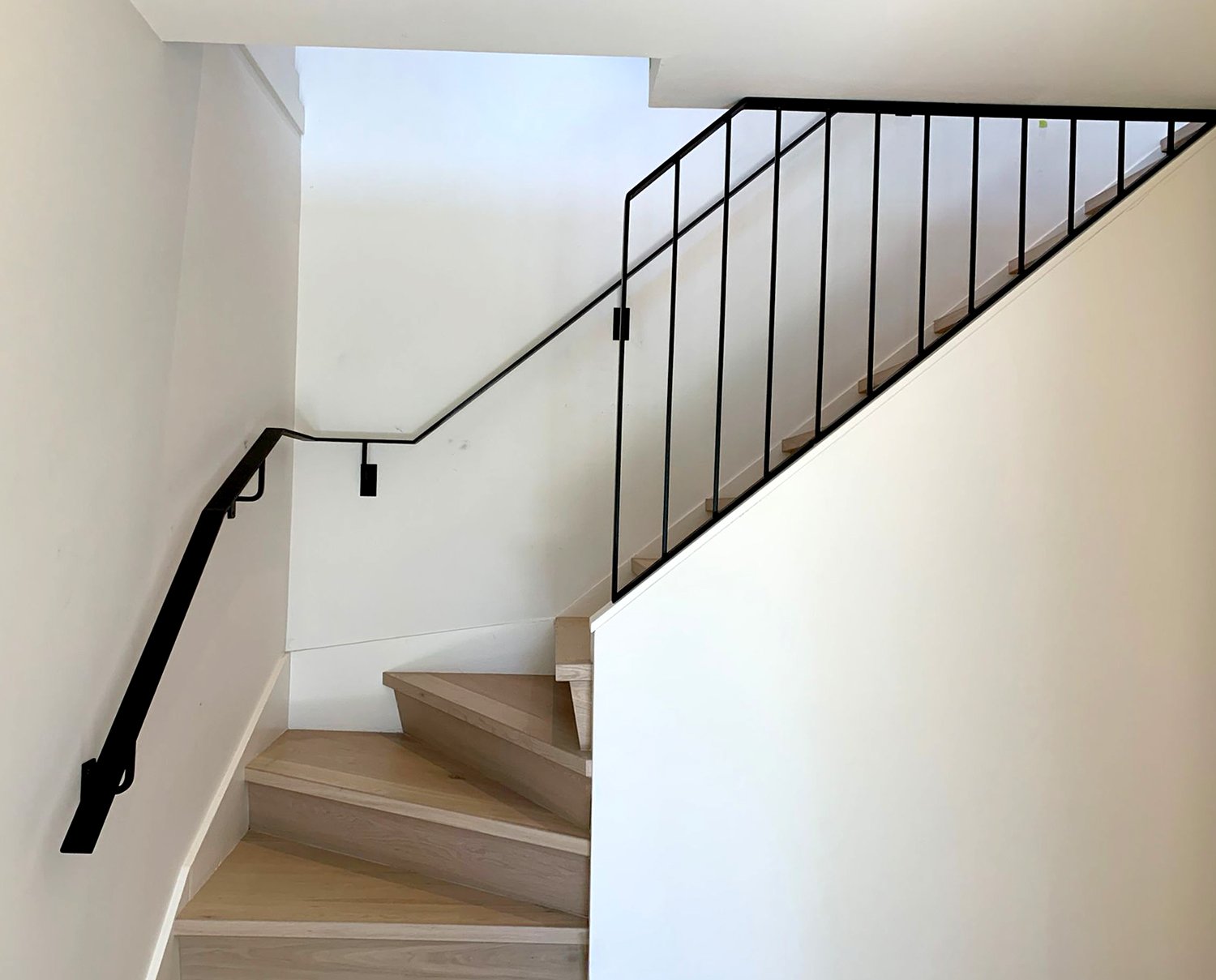 Modern staircase railing in matte black finish Vancouver