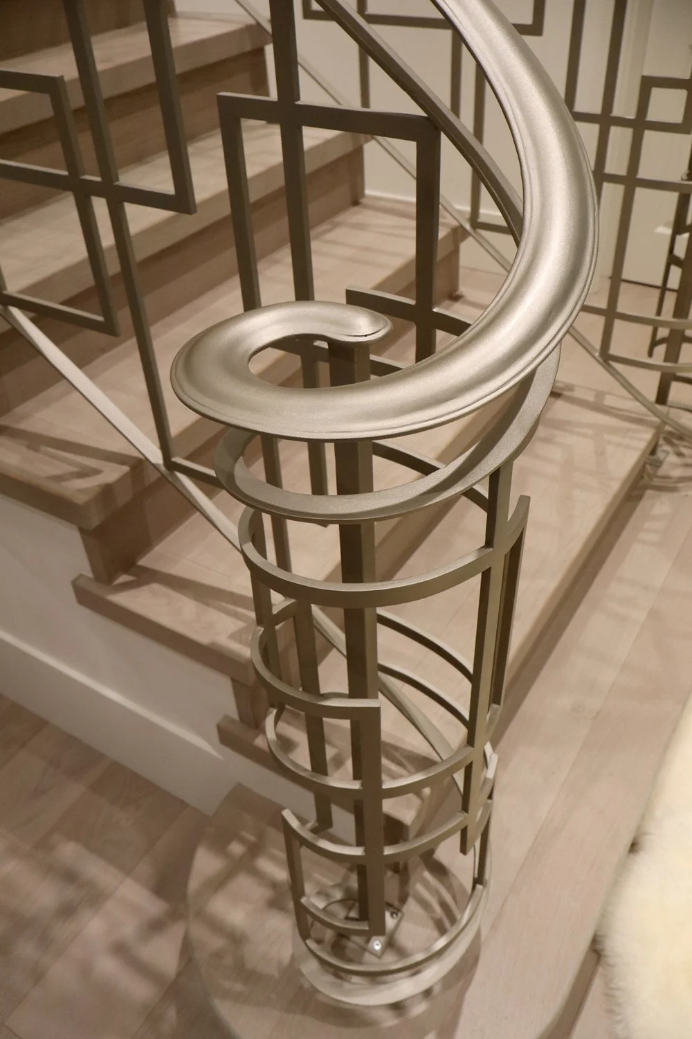 Modern interior guardrail with gold metal pickets Vancouver