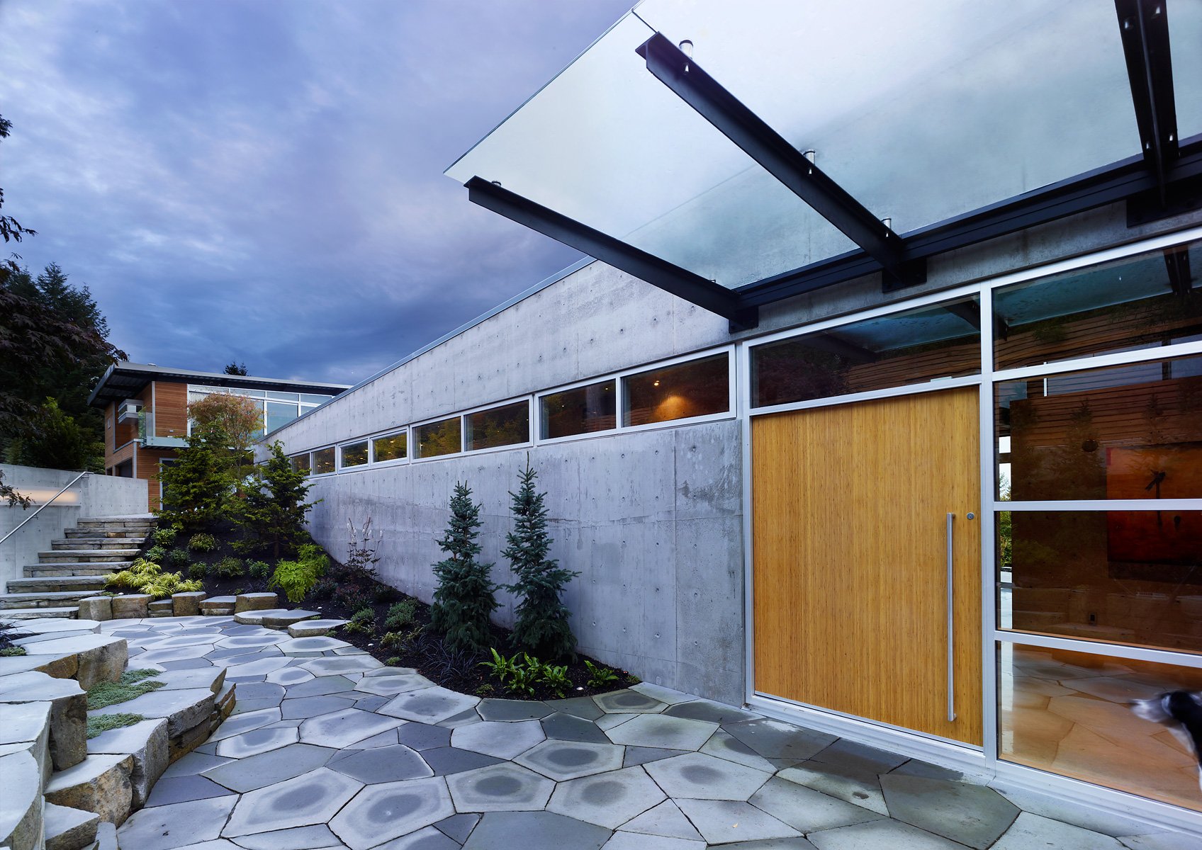 Weather protection canopy metal and glass Vancouver residential project