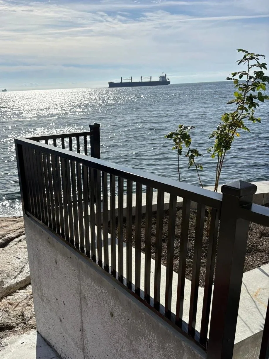 Custom black steel railing installed at a waterfront property in British Columbia
