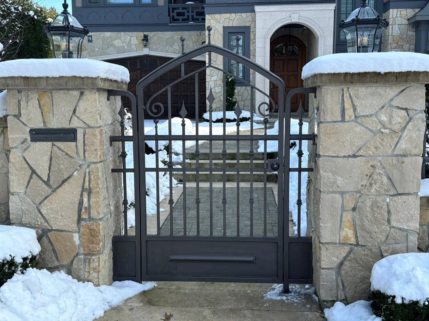 Custom walkway gate with powder-coated black steel finish – Iron Age Manufacturing 700