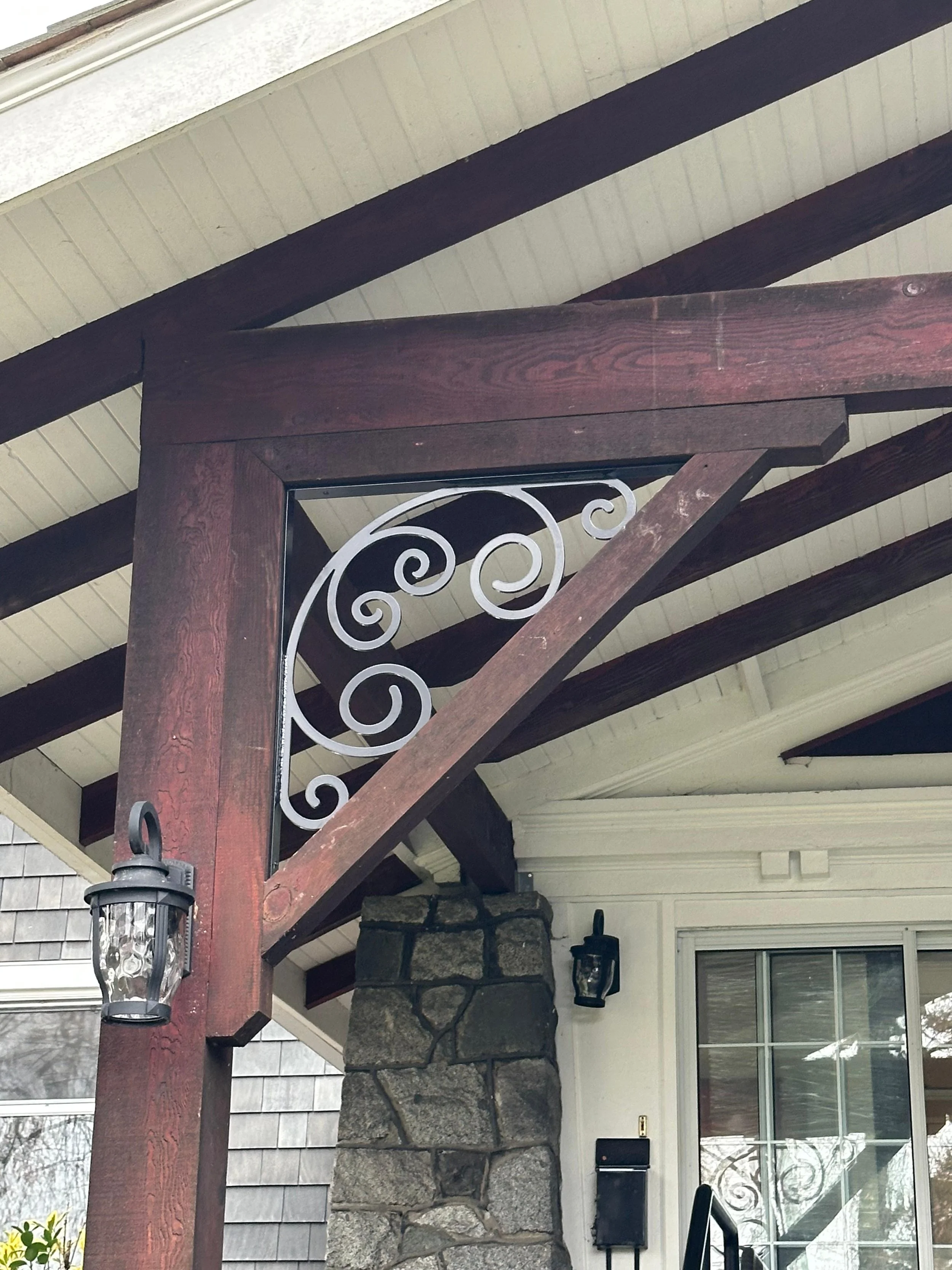 Decorative custom metal brackets for residential pergola and exterior wood structure