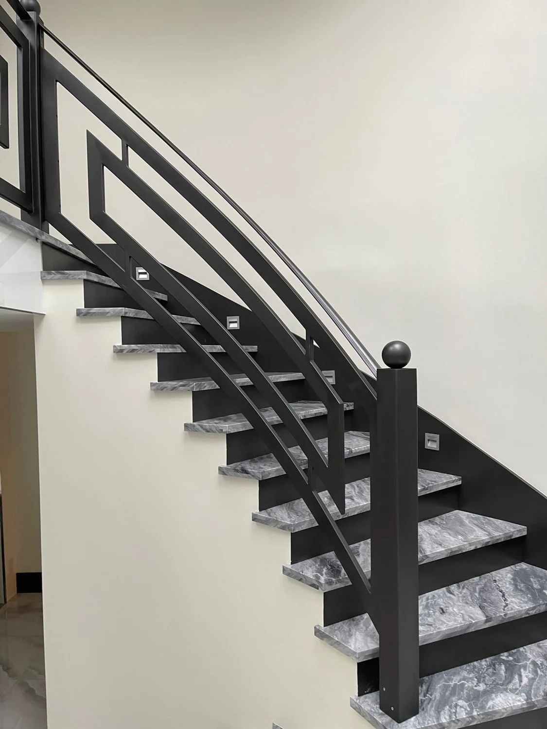 High-end staircase with custom iron balustrade Vancouver