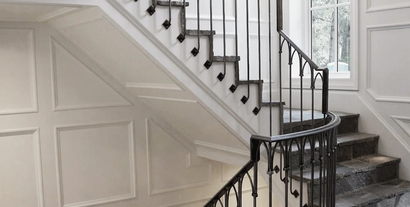 Wrought iron staircase railing with stone steps in luxury Vancouver residence
