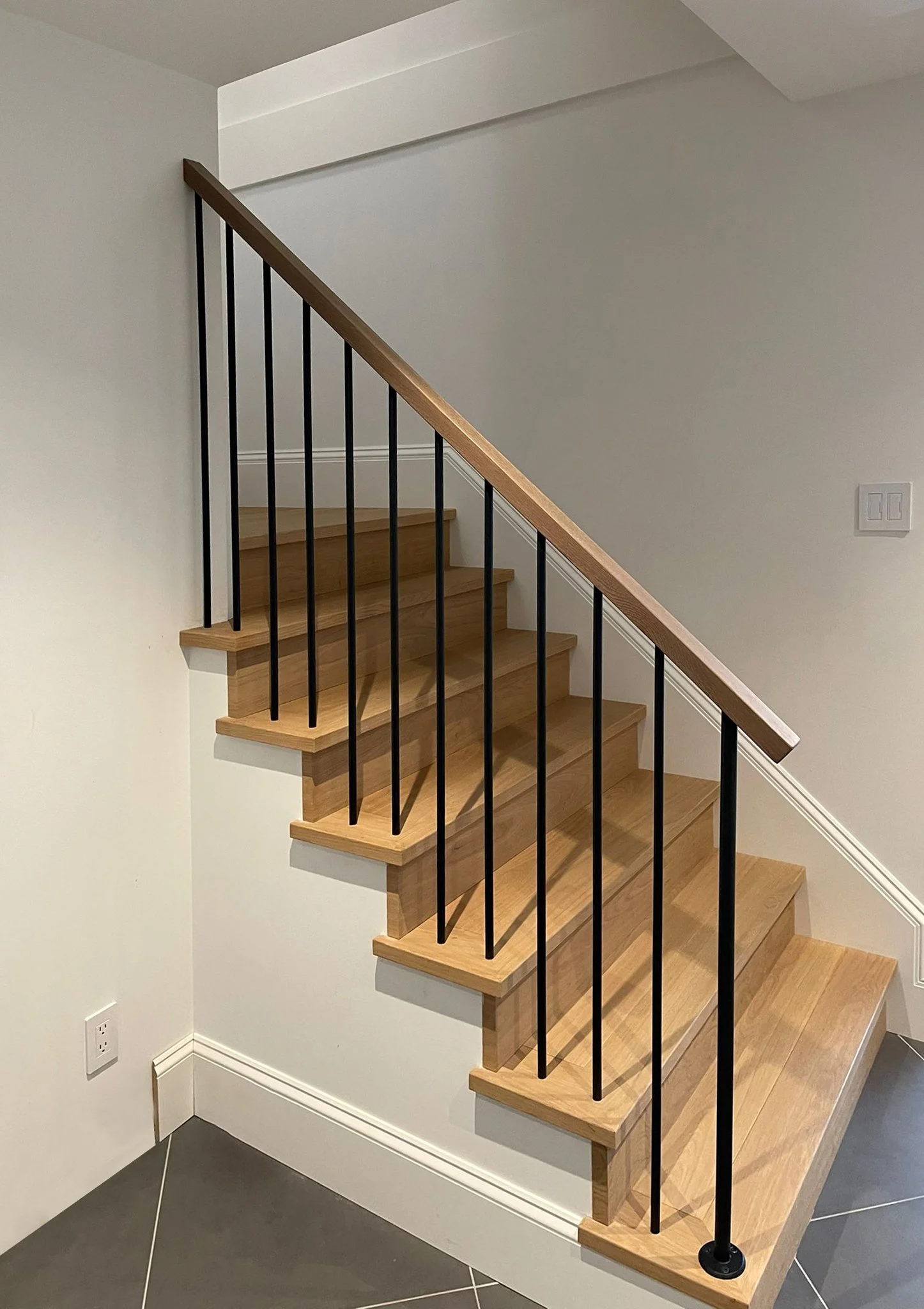 Custom interior metal stair railing installed in a Vancouver home by Iron Age Manufacturing