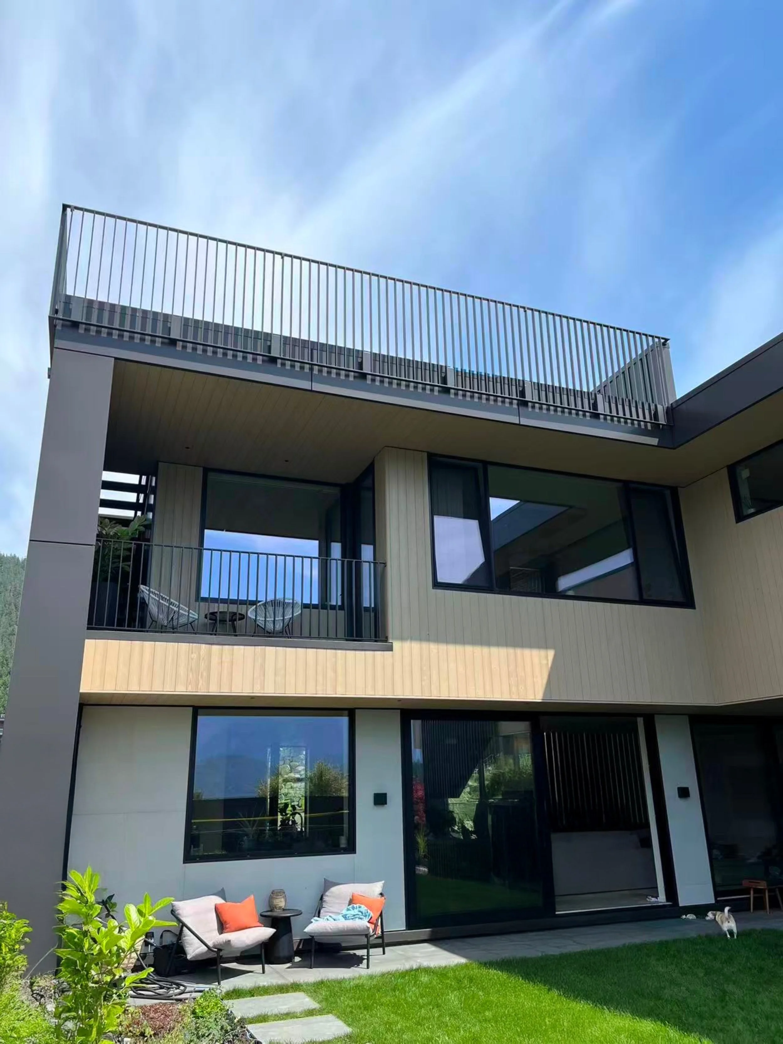 Custom black metal balcony railing installed on a modern residential home in Vancouver, BC.